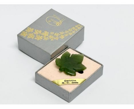 A vintage Pan Pacific Jade brooch with box.  Brooch measures 3x3.5cm 
