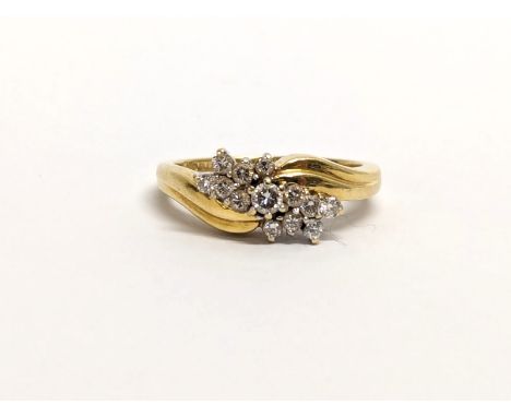 An 18ct gold diamond cluster ring. 4.63 grams. Size L. 