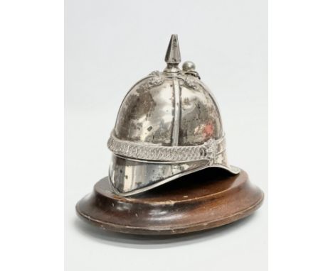 A 19th century Irish silver inkwell in the form of a British Military helmet. 17x16cm 