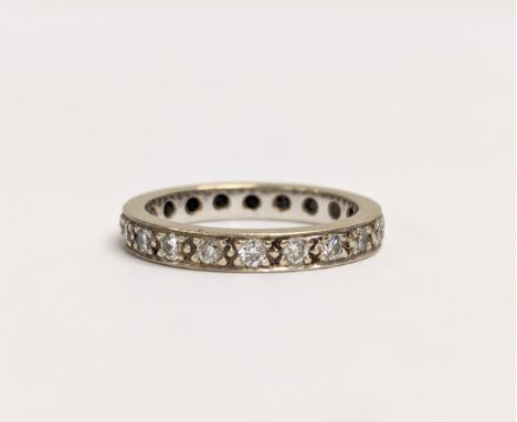 A 18ct white gold and diamond full hoop eternity ring. 1ct of diamonds. UK size N. 