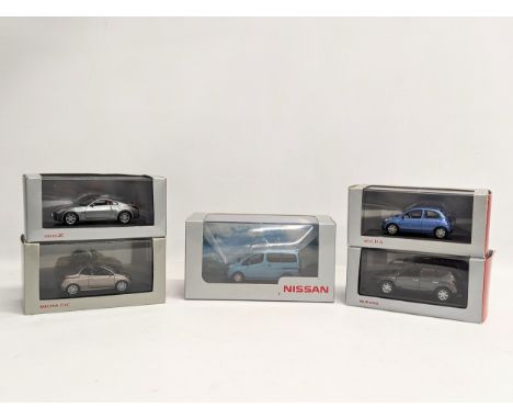 A collection of Nissan model cars by Norev, Eligor, and  J-Collection. 
