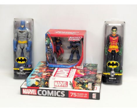 A sundry lot including 2 DC Comic figures of Batman and Robin by Spin Master, a Marvel Encyclopedia, a Marvel 75 Years of Cov