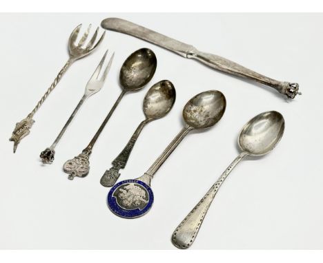 A collection of silver spoons and knife. Sterling Denmark crowned butter knife and pickle fork etc. 105.51 grams total. 