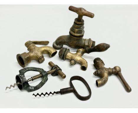 A vintage Zodiac Rollover Corkscrew and 4 early 20th century brass taps 