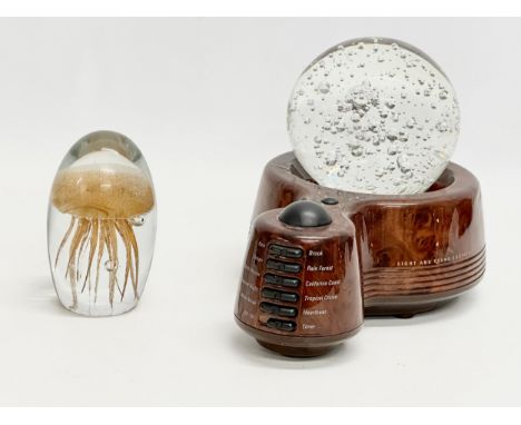 A Sharper Image Design Light and Sound Soother with large Bubble Glass paperweight and a Jellyfish paperweight. 