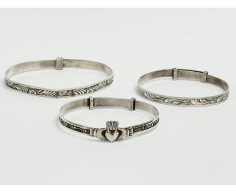 3 silver children’s bangles. Claddagh bangle measures 4.5x4cm. 14.64 grams total. 