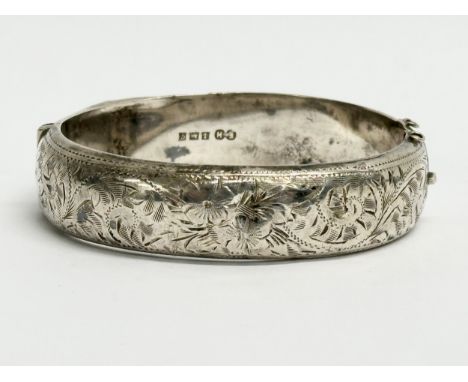 A late 19th century Edwin Horton silver bangle. 7x6cm closed. 25.31 grams. 