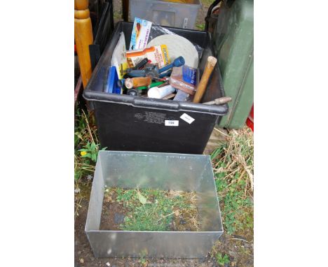 A box of various tools including a wheel brace, lump hammer, plastering floats, etc.