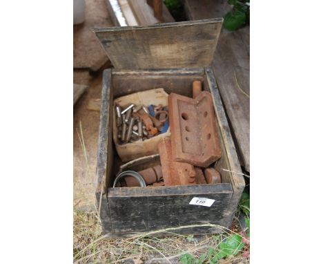 A wooden box containing machine tools.