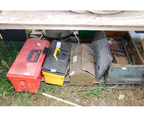 Plastic tool boxes containing tools.