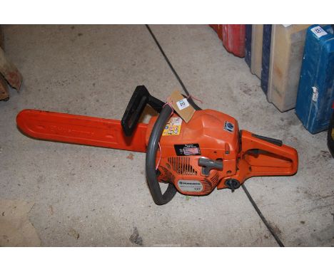 A "Husqvarna 77 Chainsaw 14" cutter bar, chain brake working.