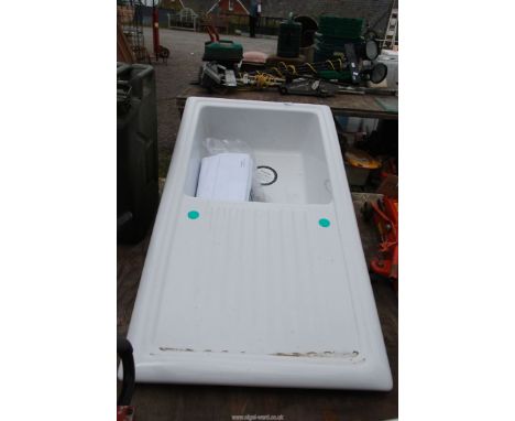 A ceramic sink unit with graining board.