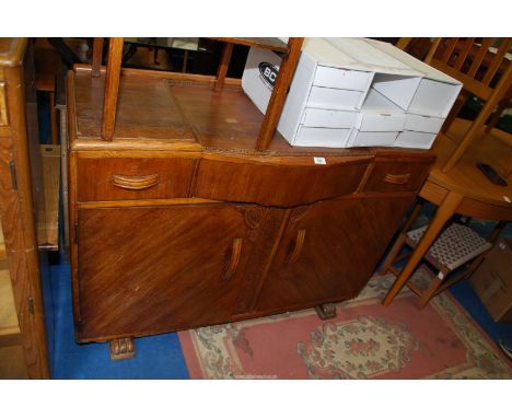 An Oak buffet Sideboard with three drawers and double doored cupboard under, 48'' wide x 34'' high x 18'' deep.