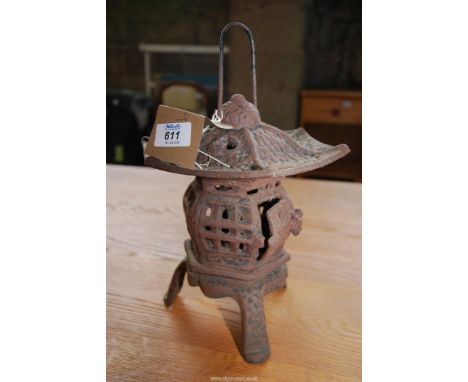 An old cast iron garden light holder.