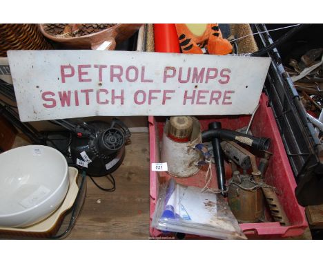 A sign 'Petrol Pumps Switch Off Here' together with a box of steel drill bits, vintage brass blow lamp, vintage enamel jug et