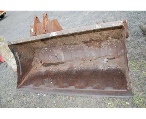 A large tractor/loader Bucket with quick release brackets, 69" wide x 40" high x 33" depth.