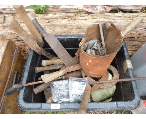 A box of various tools to include: bills, nose bag, nails, etc.