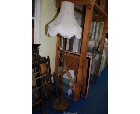 An Oak standard lamp and shade.