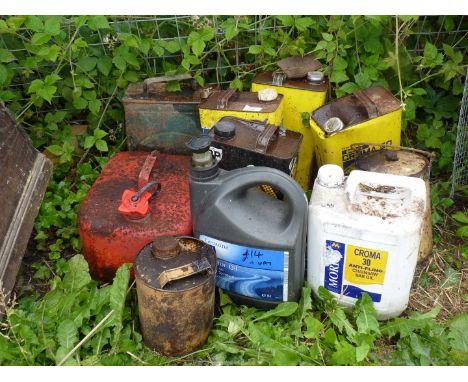 Some vintage cans, Chainsaw oil, motor oil, etc.