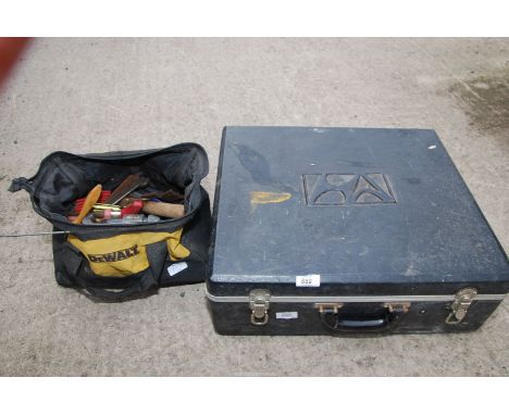 A case containing tools and a "Dewalt" tool bag and contents.