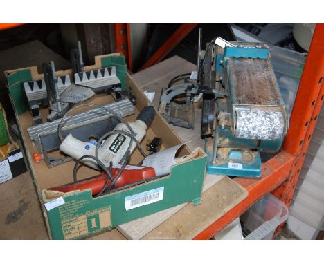 A Mitre saw jig, electric staple gun (not working/for repair), a "Einkell" 240 volt electric drill and a "Clarke" belt sander
