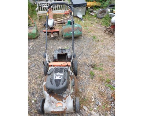 A "Flymo" self propelled lawn mower with a "Briggs and Stratton" engine. (ceased) as found.