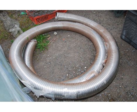 A ceramic shower tray (used) and a roll of stainless steel flue liner. 6" x 31 1/2" x 47".