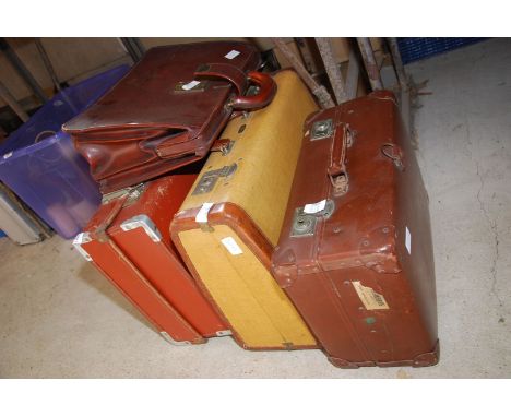 A briefcase and three other cases.