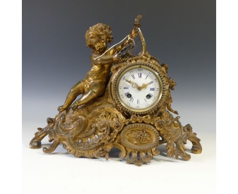 A French gilt metal figural Mantel Clock, late 19th century, the neoclassical case surmounted by a cherub with harp, white en
