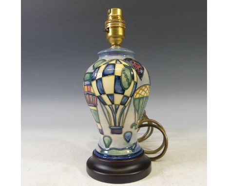 A Moorcroft 'Balloon' pattern Table Lamp, with tubelined decoration on blue ground, H 26cm. 