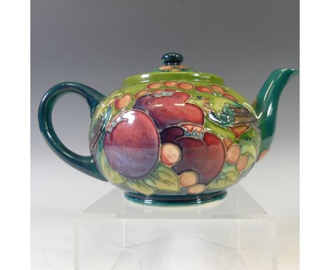 A Moorcroft 'Finch' pattern Teapot,&nbsp;with tubelined decoration on green ground, factory marks to base, 23cm long. 