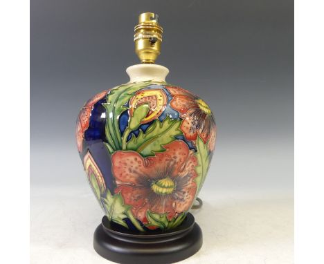 A Moorcroft 'Pheasants Eye' pattern Lamp Base, tubelined decoration on cream and blue ground, gilded mark to felt on base, H 