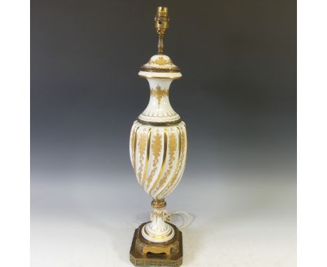 A 19thC gilt metal and milk glass Table Lamp, with gilt metal mounts and gilt floral decoration, H 63cm. 