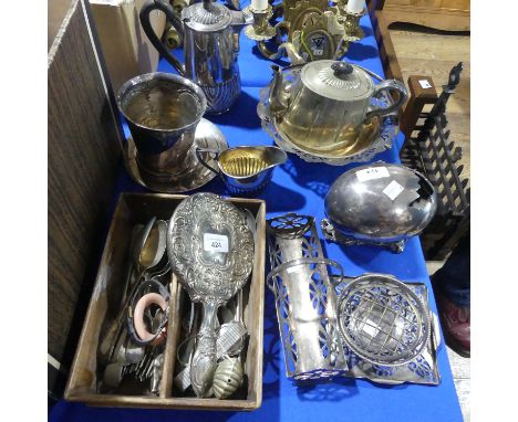 A silver plate egg on a nest of ferns, together with various other items of silver plate, including hot water jug, swing hand