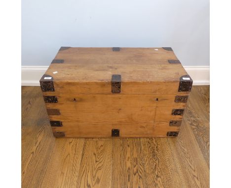 A vintage iron bound pine Trunk, with metal lining and cast iron carrying handles, W 85cm x D 50cm x H 46cm.