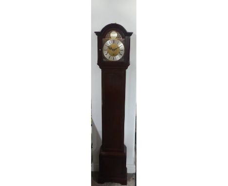 A 1970’s stained walnut Grandmother Clock, by Elliott, London, retailed by Mappin &amp; Webb Ltd., with brass arched dial and