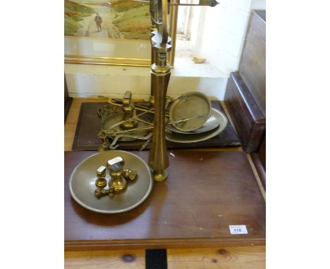 Two sets of vintage brass beam scales and a small quantity of brass weights 