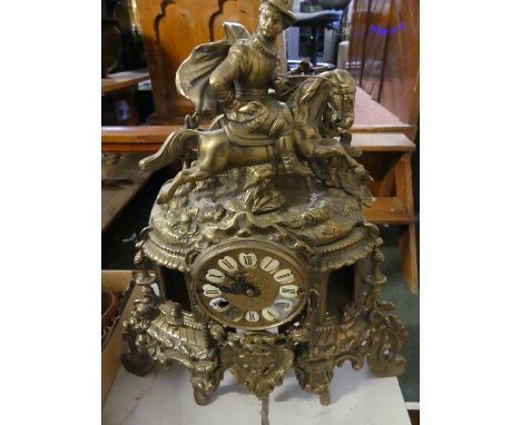 A 20th Century brass cased continental mantel clock, the ornate case with horse and rider mount.