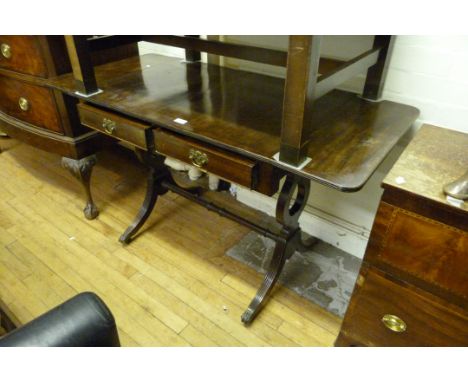 A Regency style mahogany drop leaf sofa table.