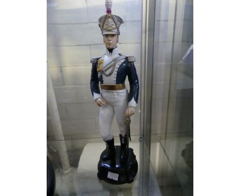 A Royal Worcester figure 'Officer of the 17th Light Gadroon Guard' no 2677. CONDITION REPORT: Repaired around skull and cross