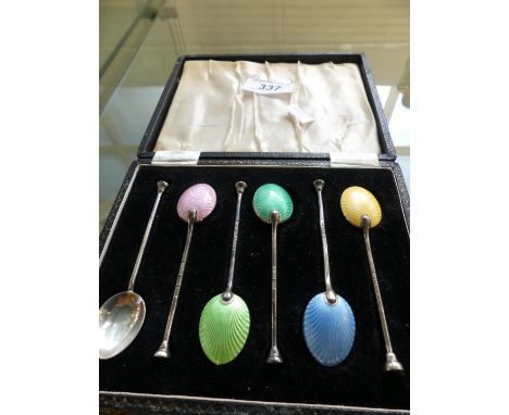 A set of six silver and enamel backed coffee spoons, Birmingham hallmarked.