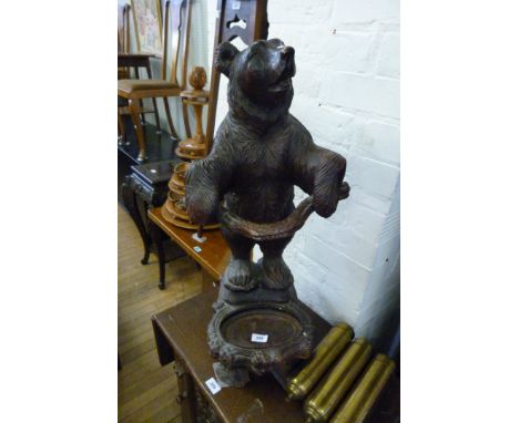 A contemporary composition stick stand modelled in the form of a Black Forest style bear on hind legs.