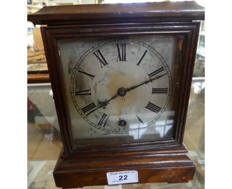 A Georgian style mahogany cased bracket clock with silvered dial, the movement marked W & H.