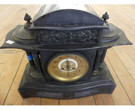A late 19th Century black slate mantel clock of architectural form.