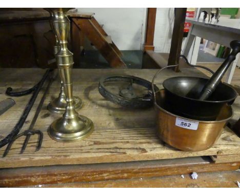 A mixed lot comprising a pair of brass candlesticks, brass folding trivet, small copper pan, pestle and mortar, iron chimney 