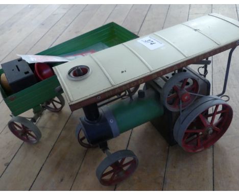 A vintage Mamod steam tractor and trailer.