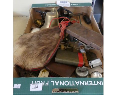 A collection of various mixed items to include cigarette lighters, brass bell, hip flask, Post Office savings bank money box,