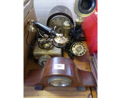 Two early 20th Century domed top mantel clocks together with a further stick telephone, a further vintage telephone with bras