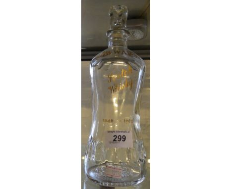 A Dewars scotch whisky commemorative clear glass decanter