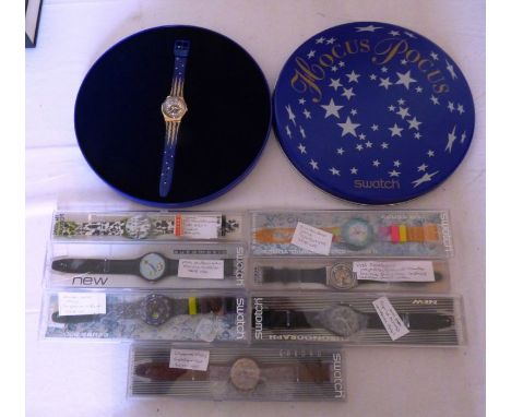 A collection of cased Swatch watches to include the 1991 book Swatchissmo Antiquorum by Ronald Carrera. A boxed and complete 